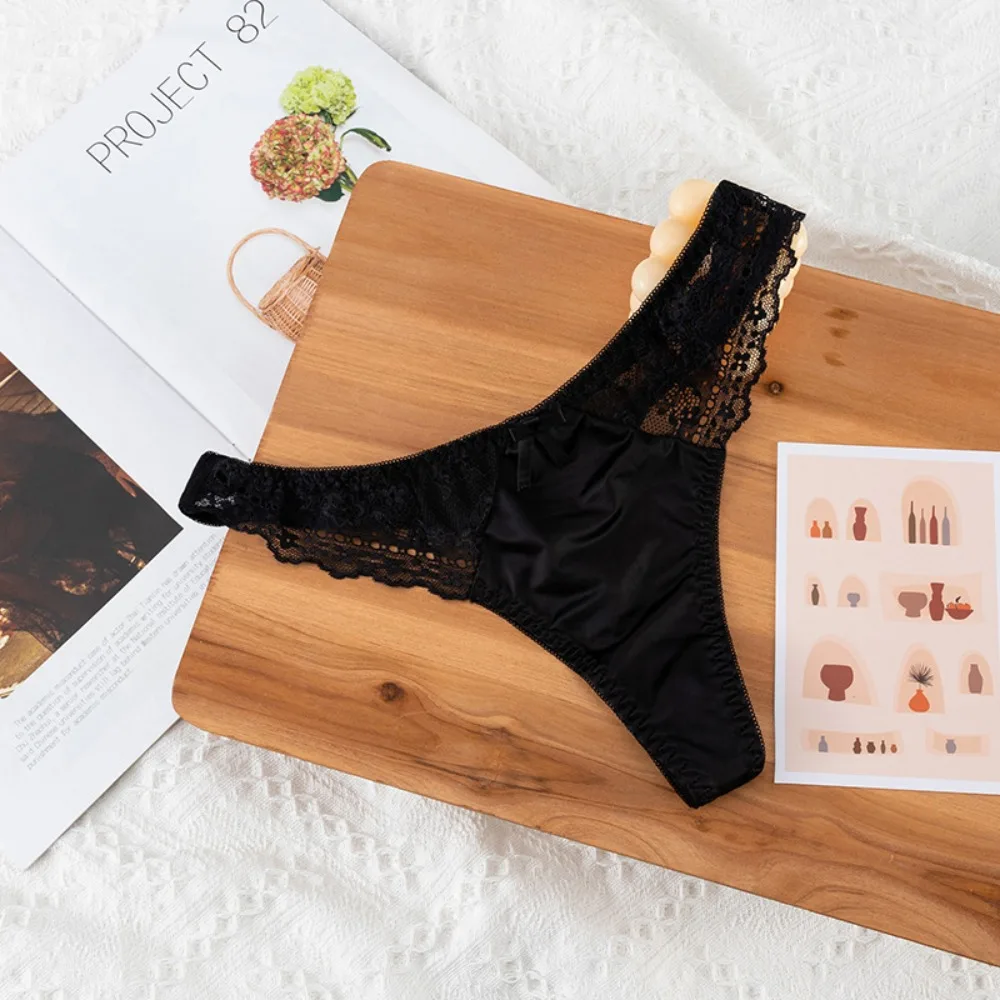 Tanga de encaje calado, sexy, de satén brillante y sedoso, para mujer, con cintura baja, estilo G-string, con lazo, sin costuras, lencería, bikini.