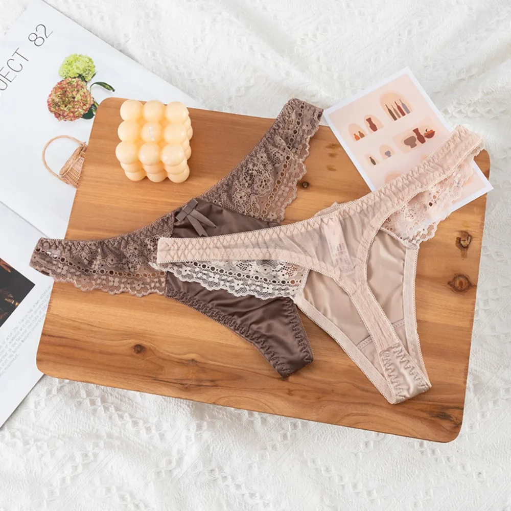 Tanga de encaje calado, sexy, de satén brillante y sedoso, para mujer, con cintura baja, estilo G-string, con lazo, sin costuras, lencería, bikini.