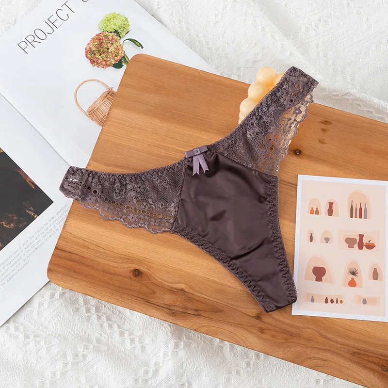 Tanga de encaje calado, sexy, de satén brillante y sedoso, para mujer, con cintura baja, estilo G-string, con lazo, sin costuras, lencería, bikini.
