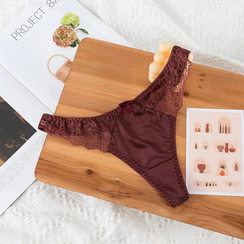 Tanga de encaje calado, sexy, de satén brillante y sedoso, para mujer, con cintura baja, estilo G-string, con lazo, sin costuras, lencería, bikini.