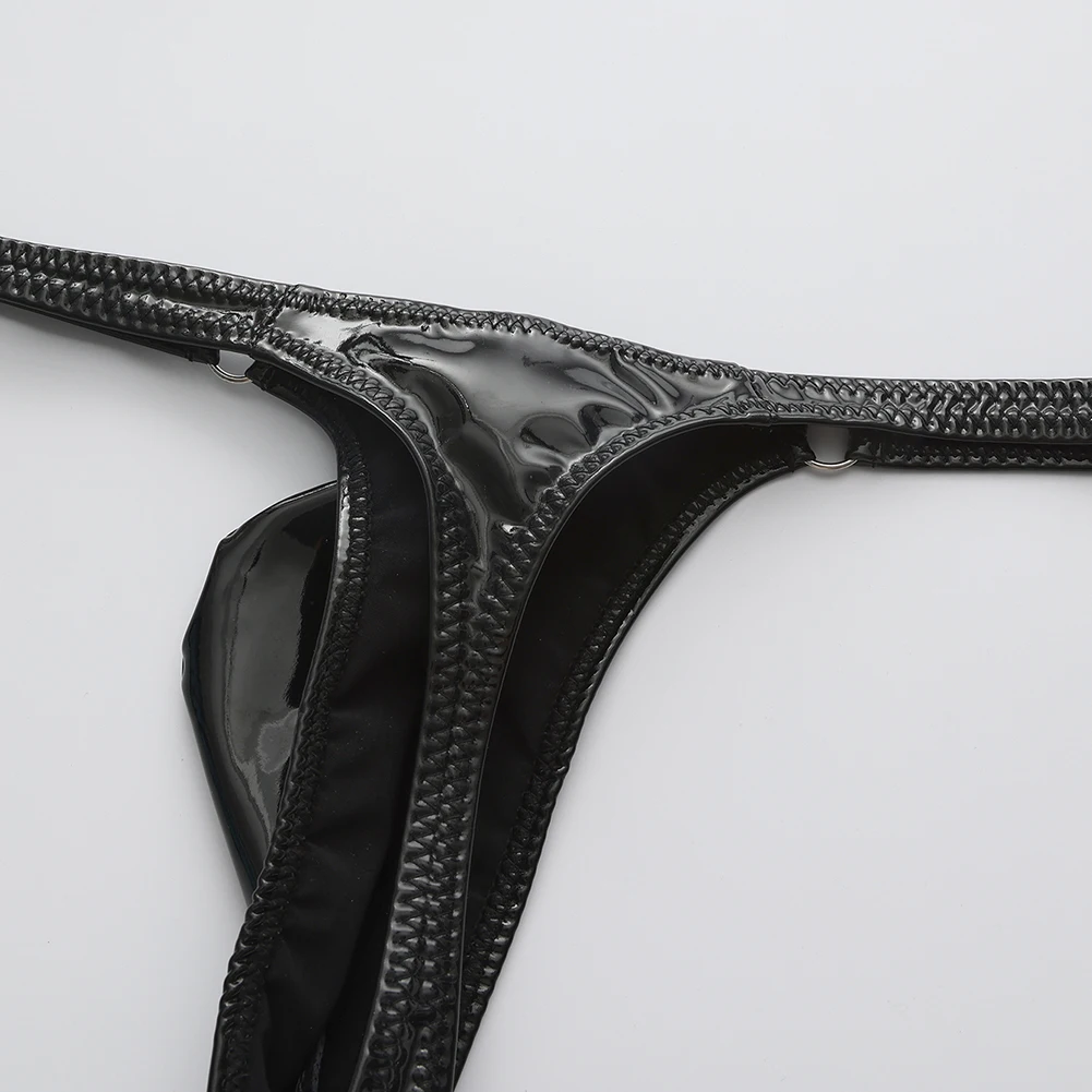 Tangas de cuero sintético brillante y atractivas para hombre, con diseño de refuerzo en la parte delantera, corte en forma de T, cintura baja, ropa interior erótica, calzoncillos de estilo «sissy».