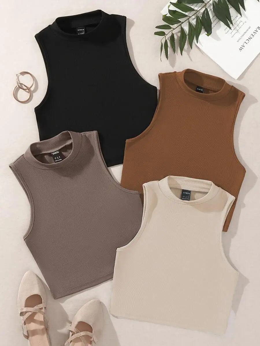 Camiseta sin mangas de corte corto con cuello alto y diseño acanalado para mujer. Camiseta sin mangas de corte corto con cuello alto y diseño acanalado para mujer.