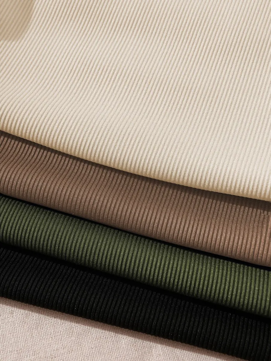 Camiseta sin mangas de corte corto con cuello alto y diseño acanalado para mujer. Camiseta sin mangas de corte corto con cuello alto y diseño acanalado para mujer.