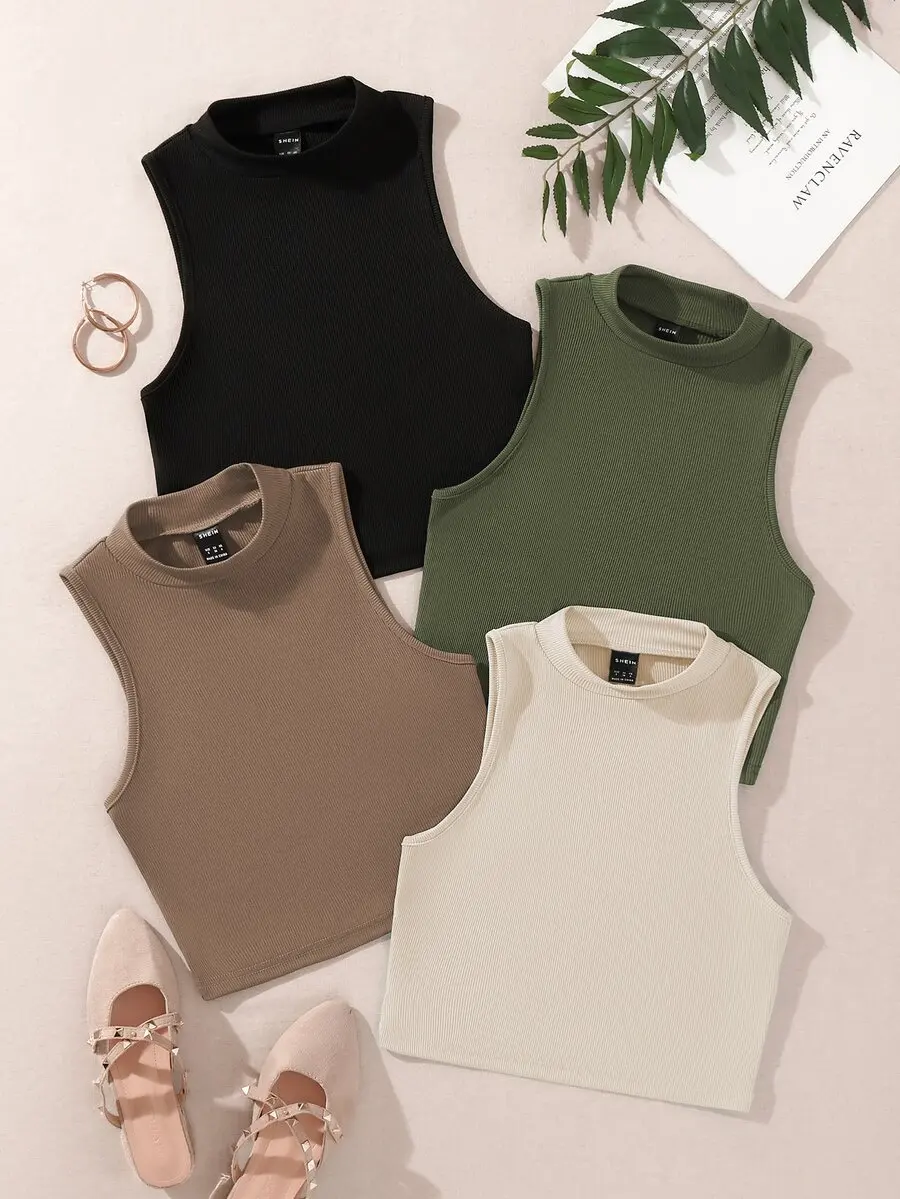Camiseta sin mangas de corte corto con cuello alto y diseño acanalado para mujer. Camiseta sin mangas de corte corto con cuello alto y diseño acanalado para mujer.